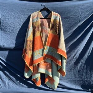 Poncho/loose cardigan/sweater orange/blue/brown with geometric design